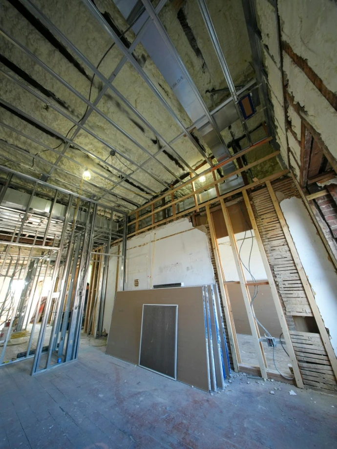 Interior construction with metal studs and drywall sheets.
