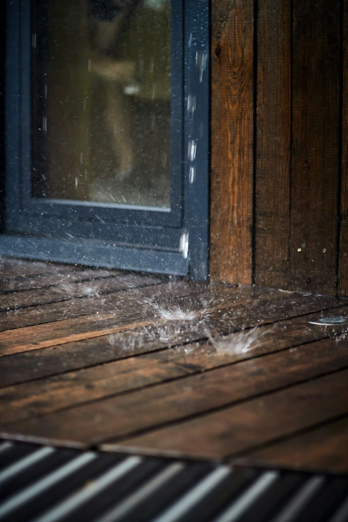 water dripping on wooden wall and floor