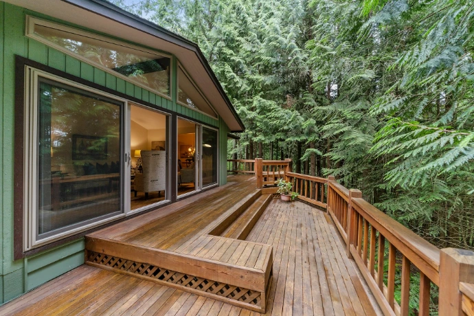 brown wooden deck outside clear glass door
