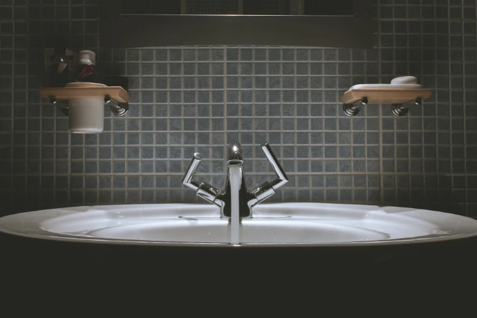 gray steel faucet and other fixtures