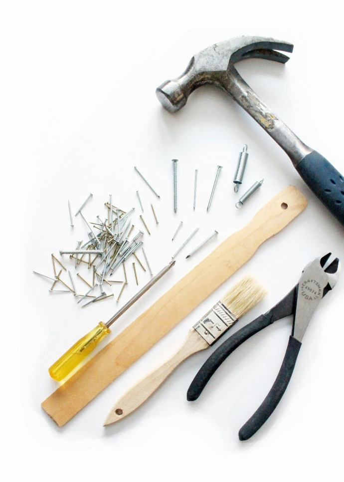 yellow and black handle hammer, screw driver, and various other tools