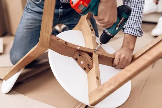worker assembling a chair
