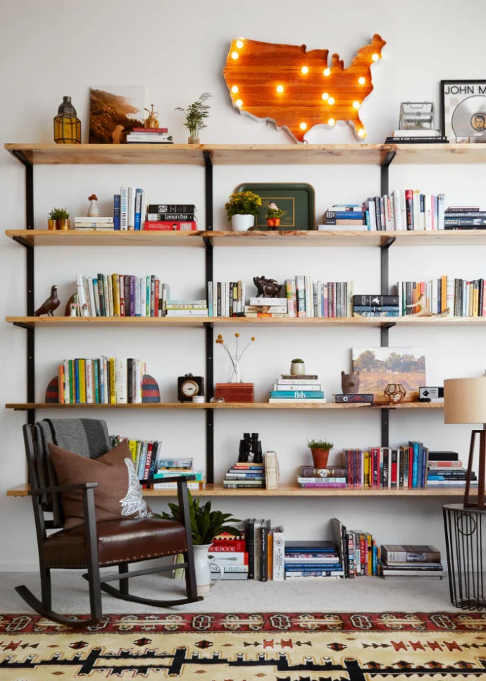 tall modern wall bookshelves in a room